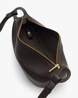 Open handbag with visible zipper and interior pocket.