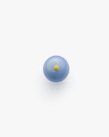 Blue marble with a small yellow dot in the center.