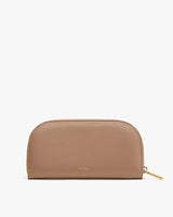 A minimalist, half-circle clutch with a zipper closure.