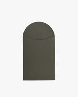 Rectangular leather laptop sleeve with a curved flap closure.