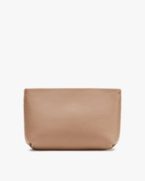 Leather pouch against a plain background