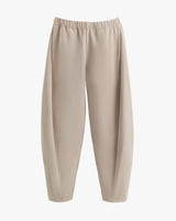 Loose-fitting pants with elastic waistband displayed against a plain background.