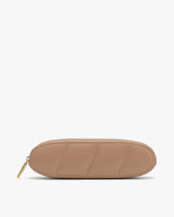 Oval-shaped pencil case with a zipper on a plain background.