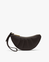 Semicircle wristlet with zipper and strap.