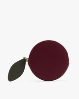 Round coin purse with leaf-shaped zipper pull tab.