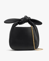 Handbag with knotted top handle and chain strap