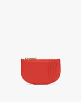 Small coin purse with zipper and curved edges.