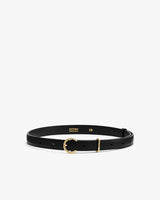 Thin belt with gold buckle on white background.