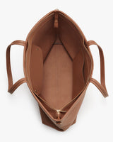 Top view of an open, empty handbag with visible inner compartments.