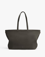 Large handbag with two handles and a logo near the bottom center.
