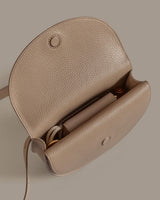 Open handbag with visible contents inside.