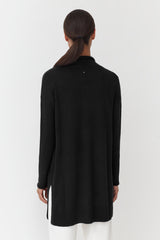 Person from behind, standing straight, hands not visible.