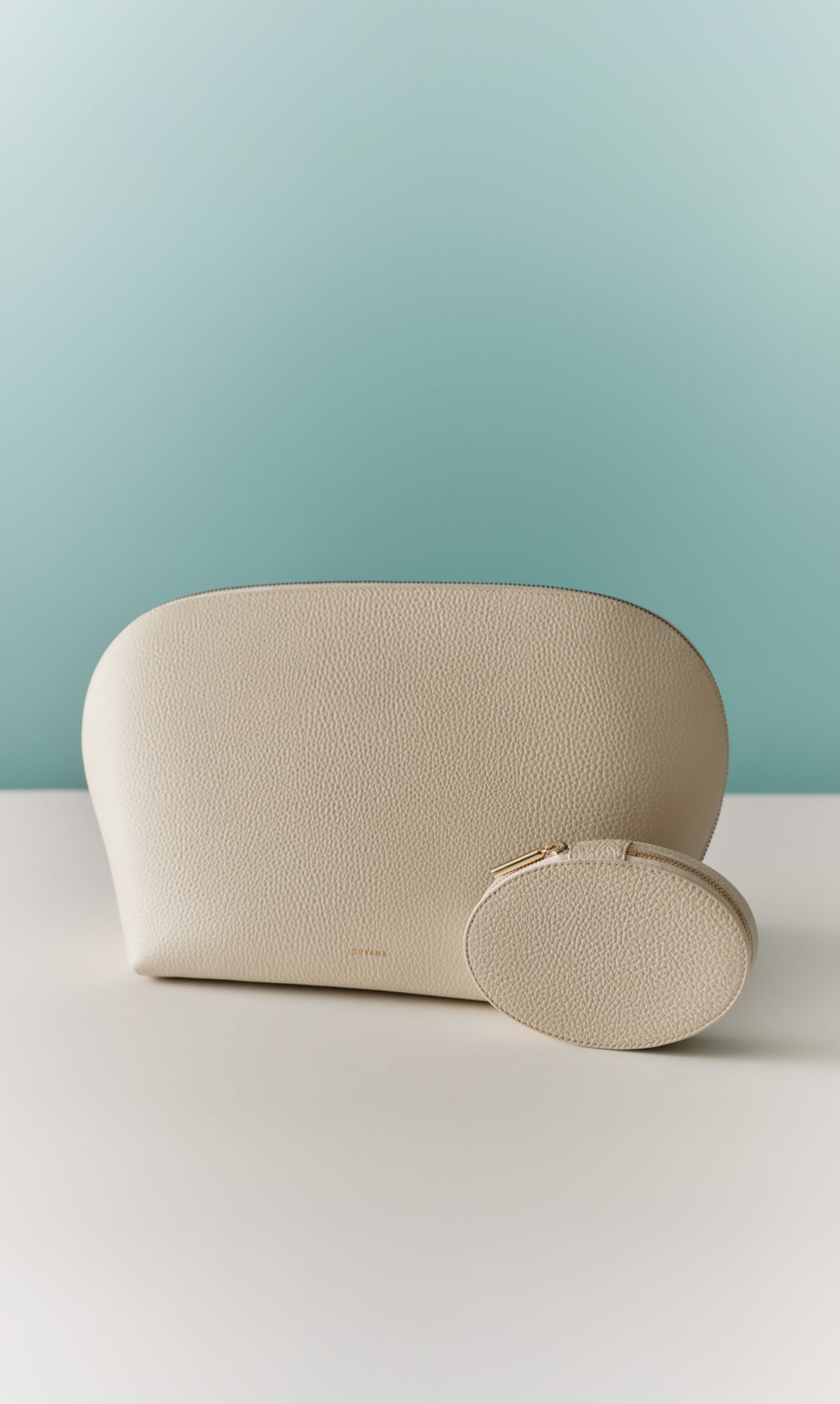 Large pouch and small round pouch on surface