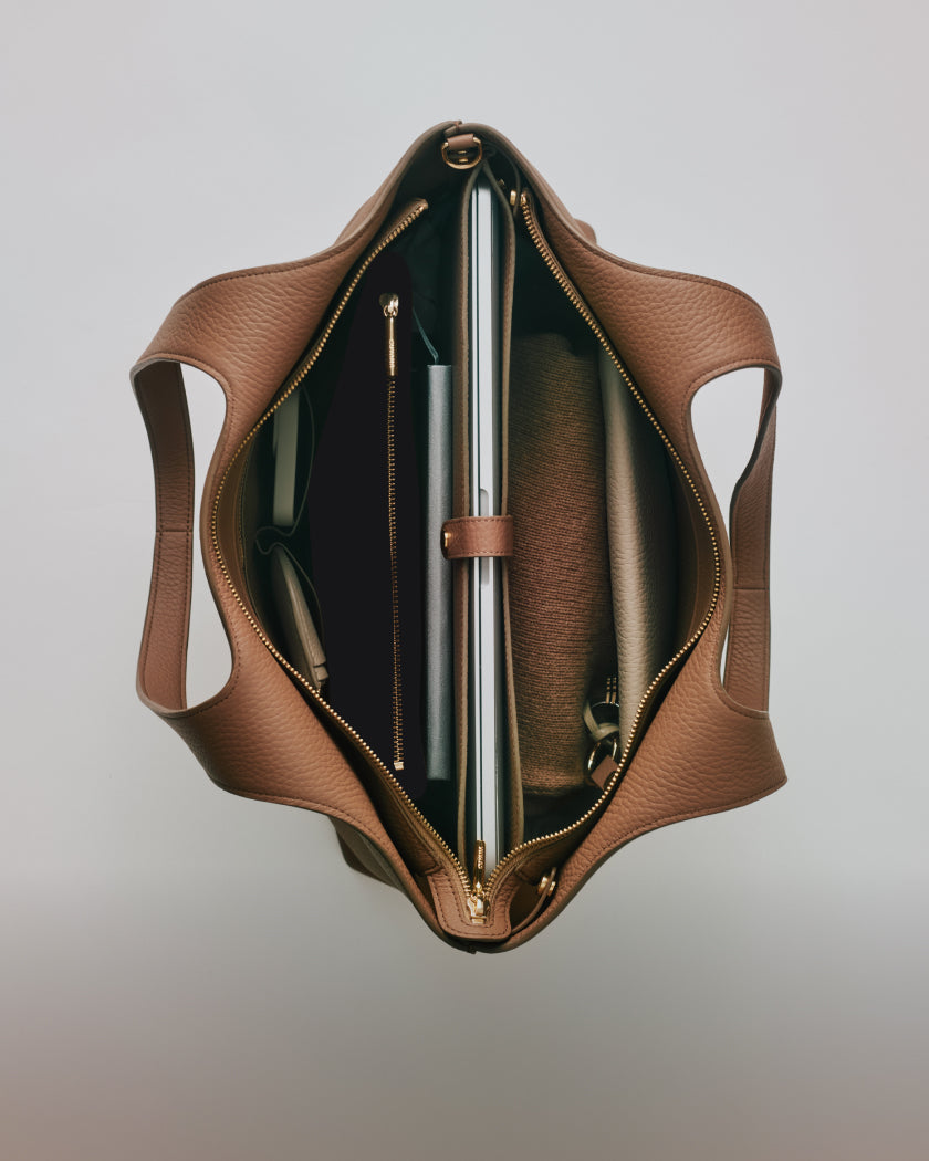 Open tote bag displaying organized contents inside.
