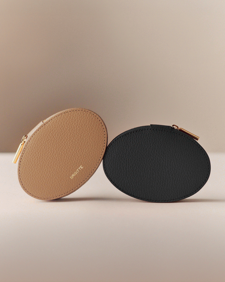 Two oval-shaped coin purses standing upright.