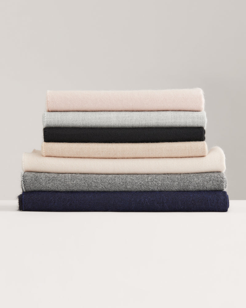 A stack of folded fabric arranged in layers.