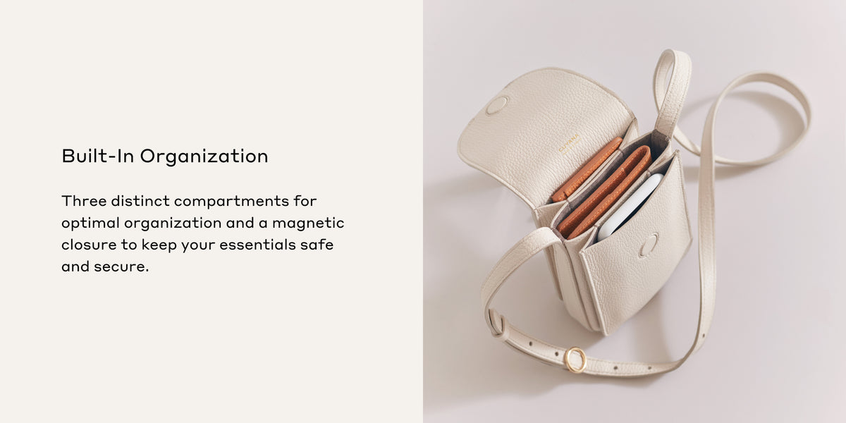 Open bag with three compartments displaying makeup items inside.