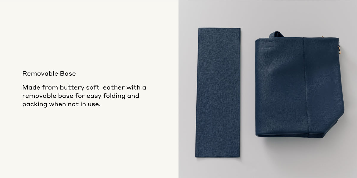 Leather bag with its removable base positioned next to it.