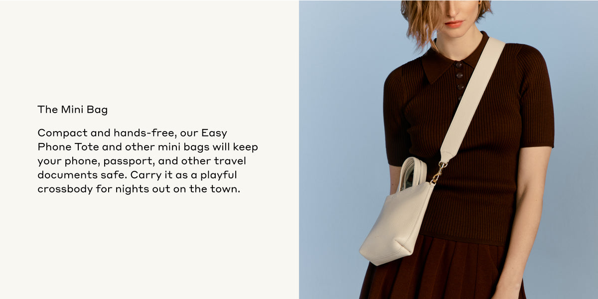 Woman standing with a mini bag across her shoulder.