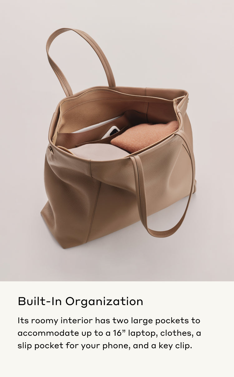 Bag open to reveal interior with pockets, holding a laptop and small items.