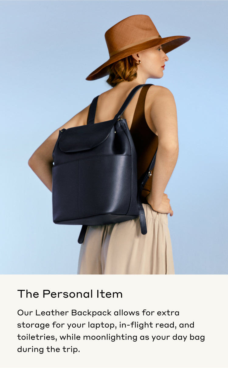 Woman in hat with backpack looking over shoulder