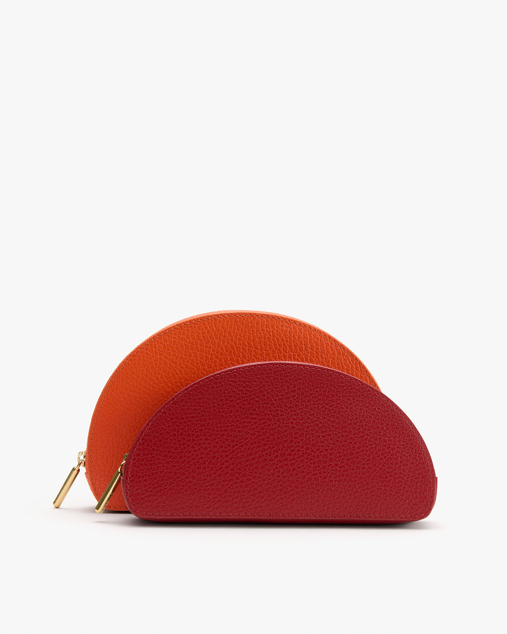 Two semicircular pouches with zippers, one slightly larger and behind the other.