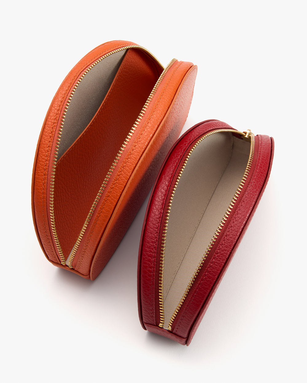 Two open zippered pouches in different sizes, placed side by side.