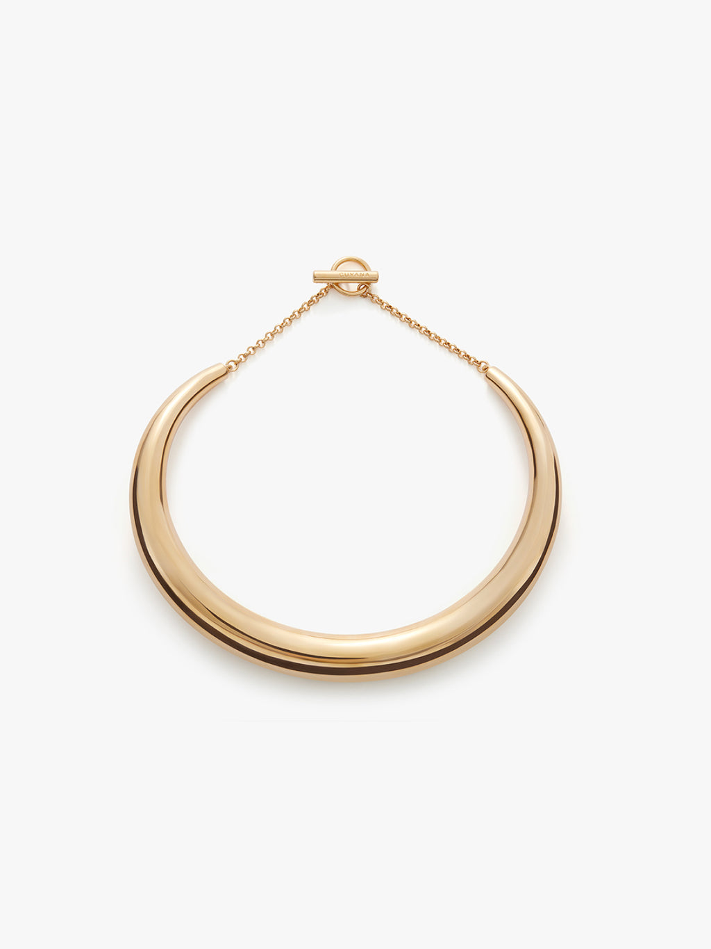 Curved bracelet hanging against a light background.
