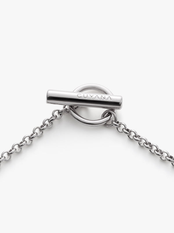 Silver chain with a toggle clasp.