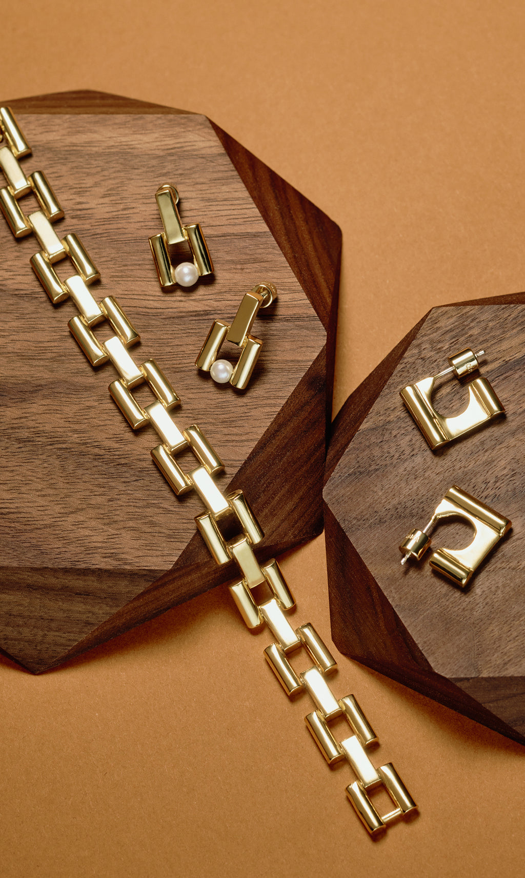 Geometric jewelry on wooden displays.