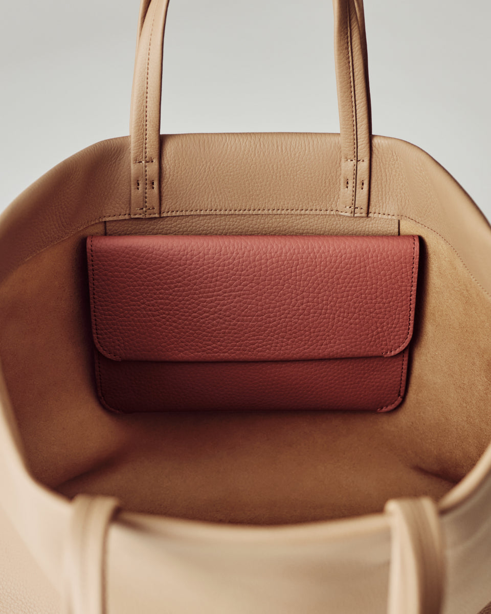 Open purse with small pouch inside.