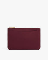Small zippered pouch with textured leather and one exterior pocket.