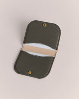 Open card holder displaying two slots with cards inside.