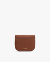 Small leather wallet with brand name on the front.