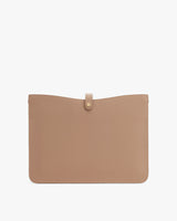 Simple leather clutch with a flap closure.