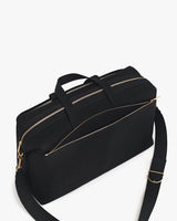 Travel bag with two zipper compartments and an adjustable shoulder strap.