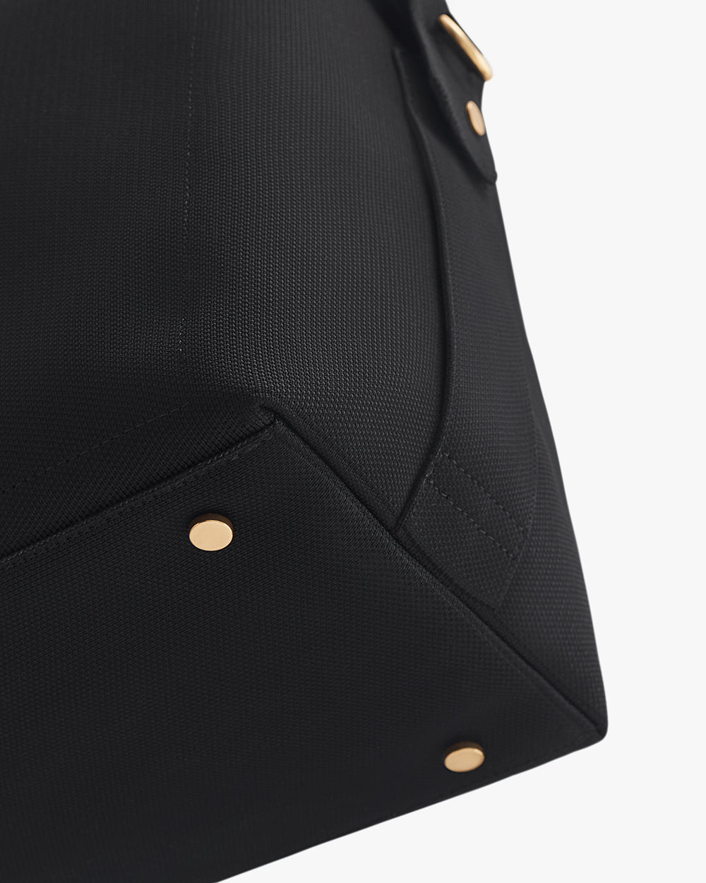 Corner of a travel bag with metal studs