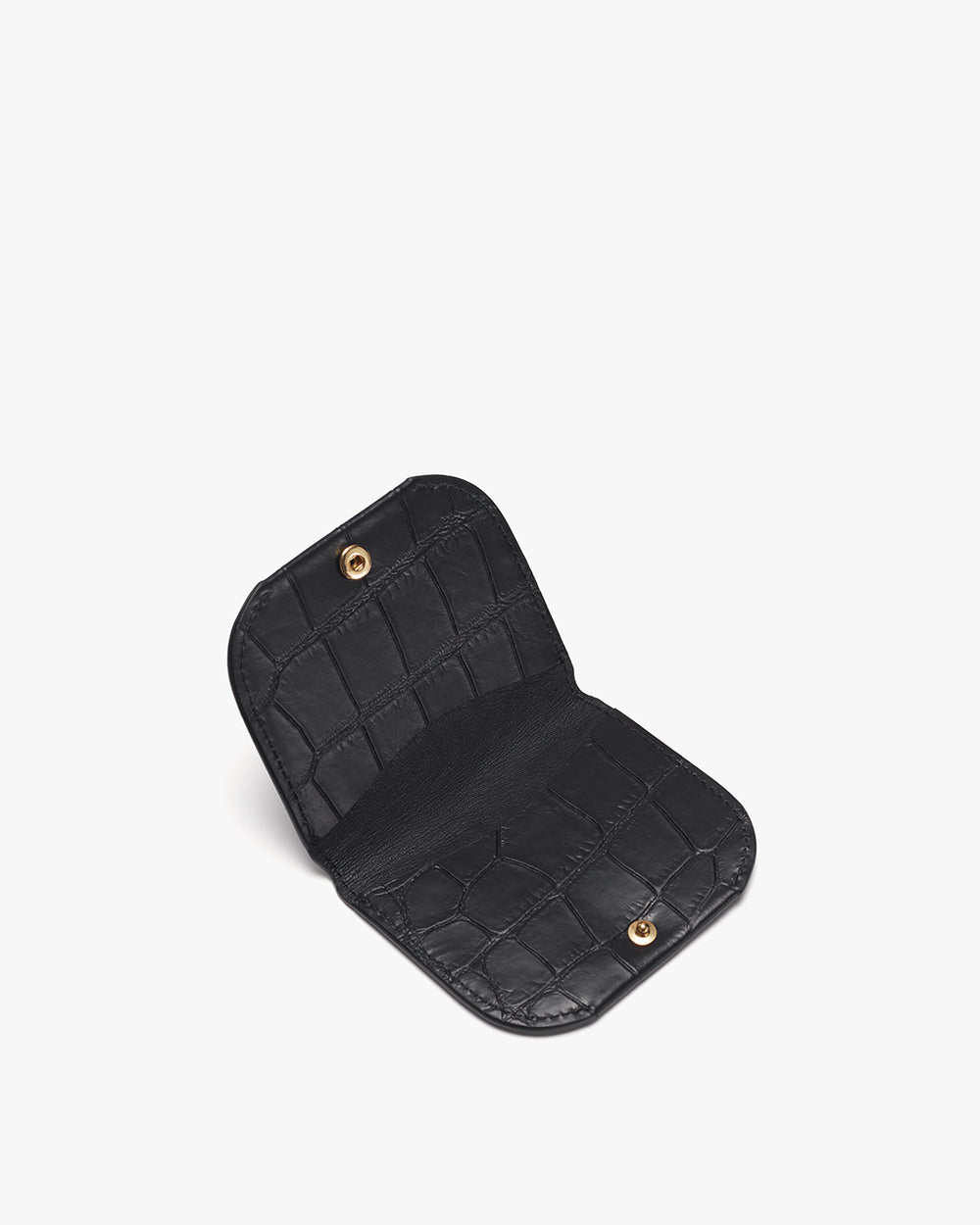 Open wallet with textured surface and snap buttons.