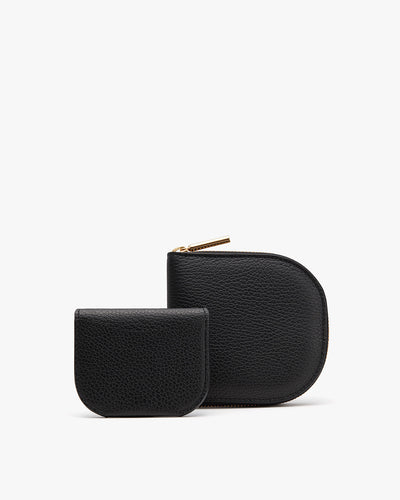 Two small pouches, one larger than the other, both with zippers.