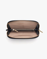 Open wallet with compartments and a zipper closure.