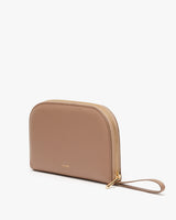 Zippered pouch with wrist strap standing upright.