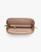 Open wallet with zipper showing compartments and a pen inside.