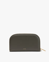 Curved zippered pouch with brand name on front.