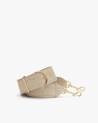 Small handbag with textured surface and a metal buckle, displayed on a plain background.