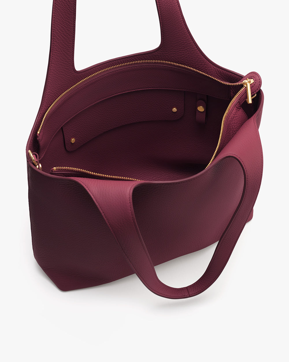 Open tote bag with a zippered pocket inside and handles.