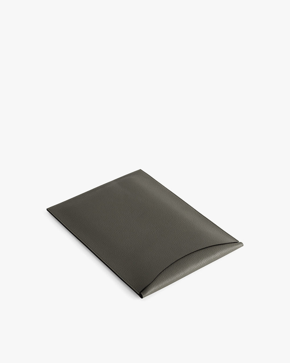 Rectangular leather laptop sleeve with a curved flap closure.