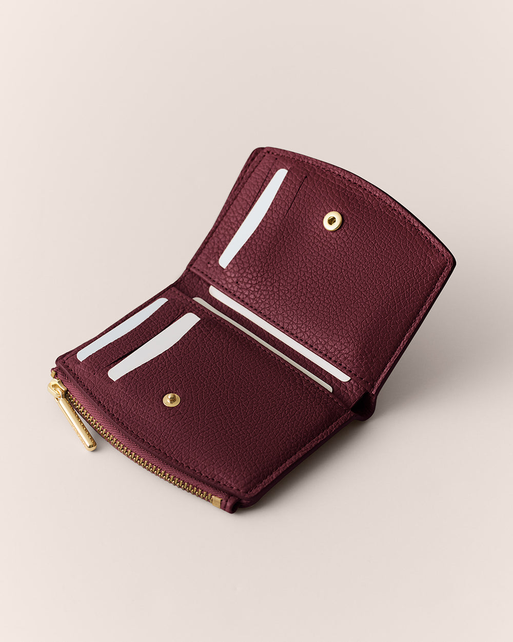 Open wallet with card slots and a zipper section