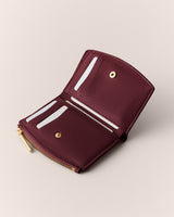 Open wallet with card slots and a zipper section