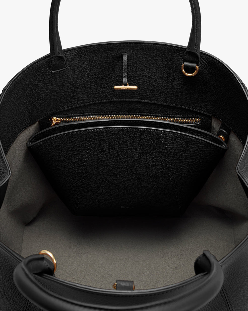 Open handbag with zippered inner pocket and handle straps.