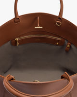 Open handbag showing inside pocket and zipper
